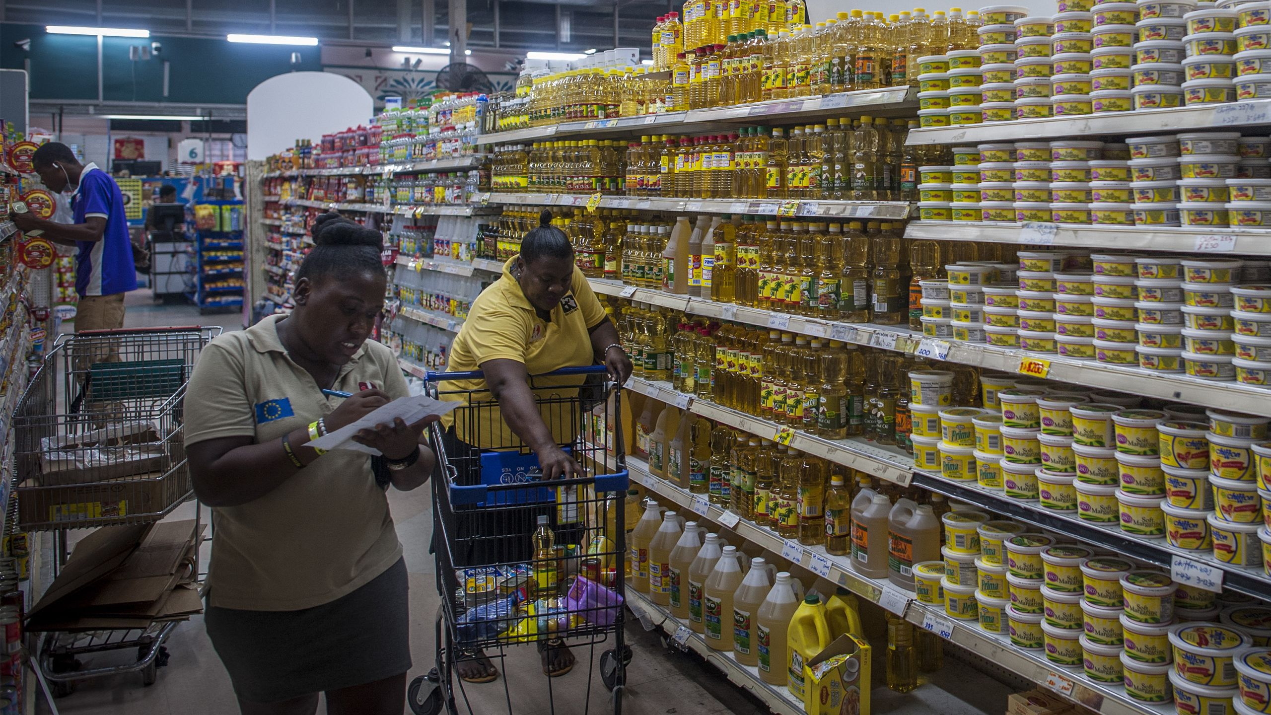 Two women shop in a grocery store